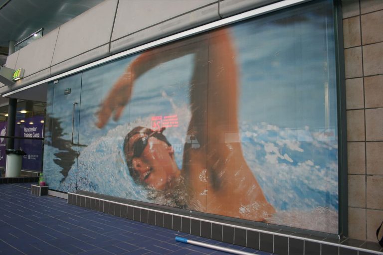 Manchester Aquatic Centre Training Camp - digitally printed one way vision film contravision window graphics