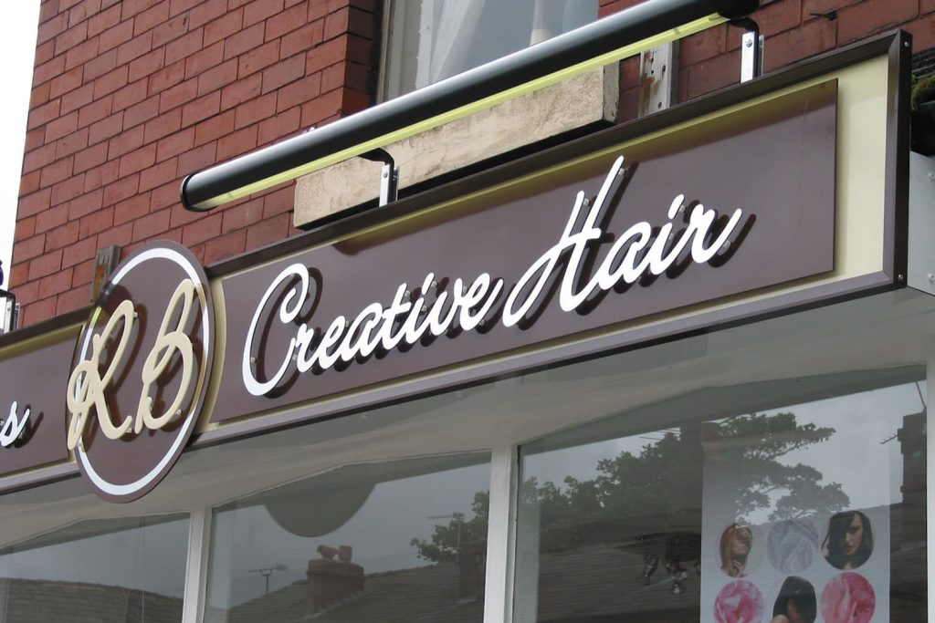 RB Creative Hair - flat cut acrylic letters trough lights framed panels.