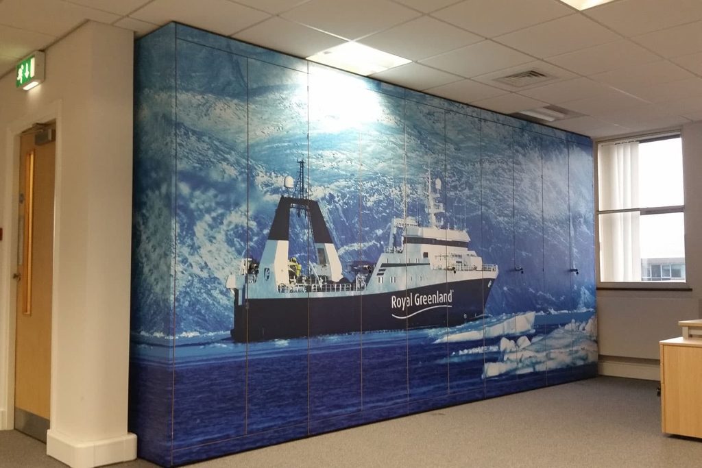 Royal Greenland - storage wall digitally printed wall wrap covering cupboards