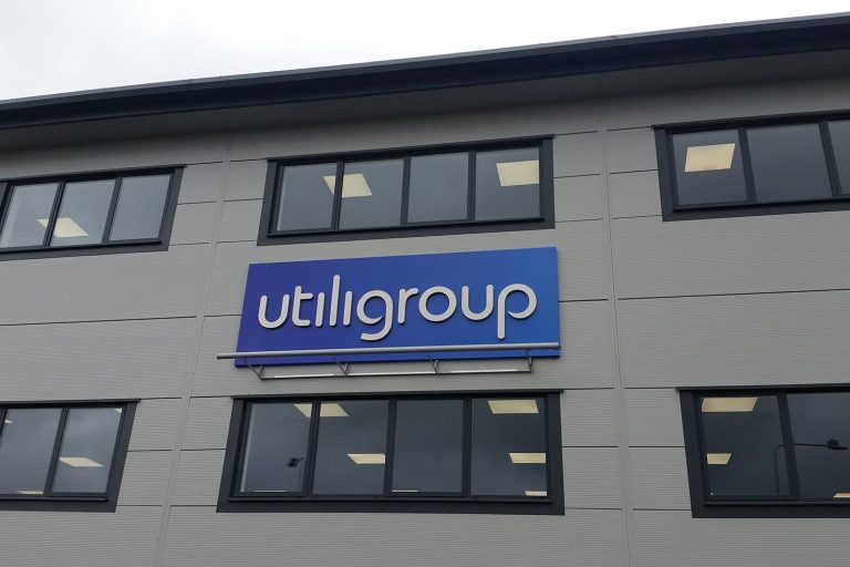 Utiligroup - head office 3D built up stainless steel letters mounted on an aluminium sign tray covered-in-digital-print