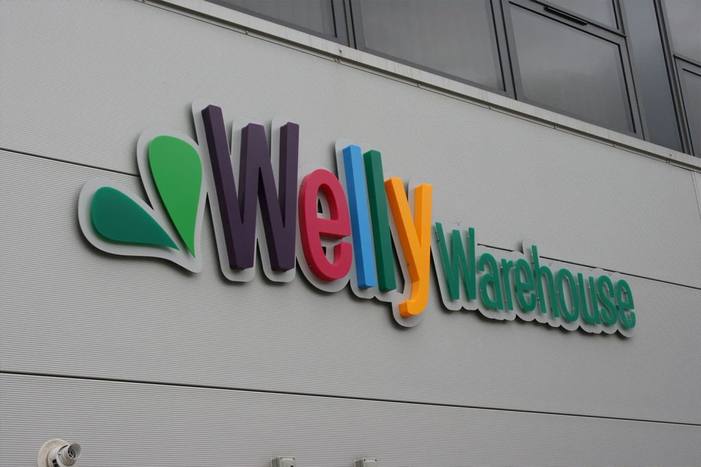 Welly Warehouse - built up and flat cut acrylic letters mounted on an aluminium panel.